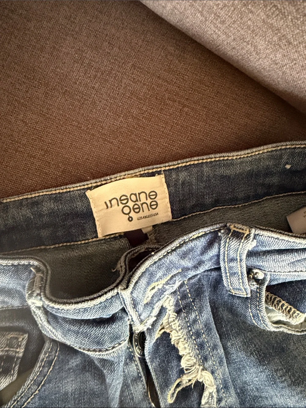 Ripped Light Blue Skinny Jeans with Button-Fly